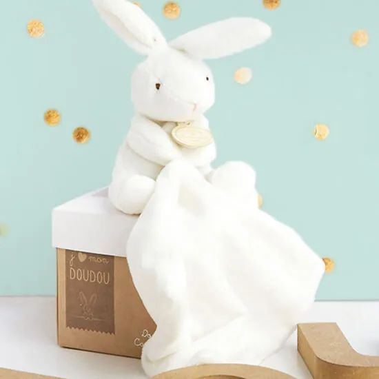 Soft white plush bunny holding a small comforter handkerchief